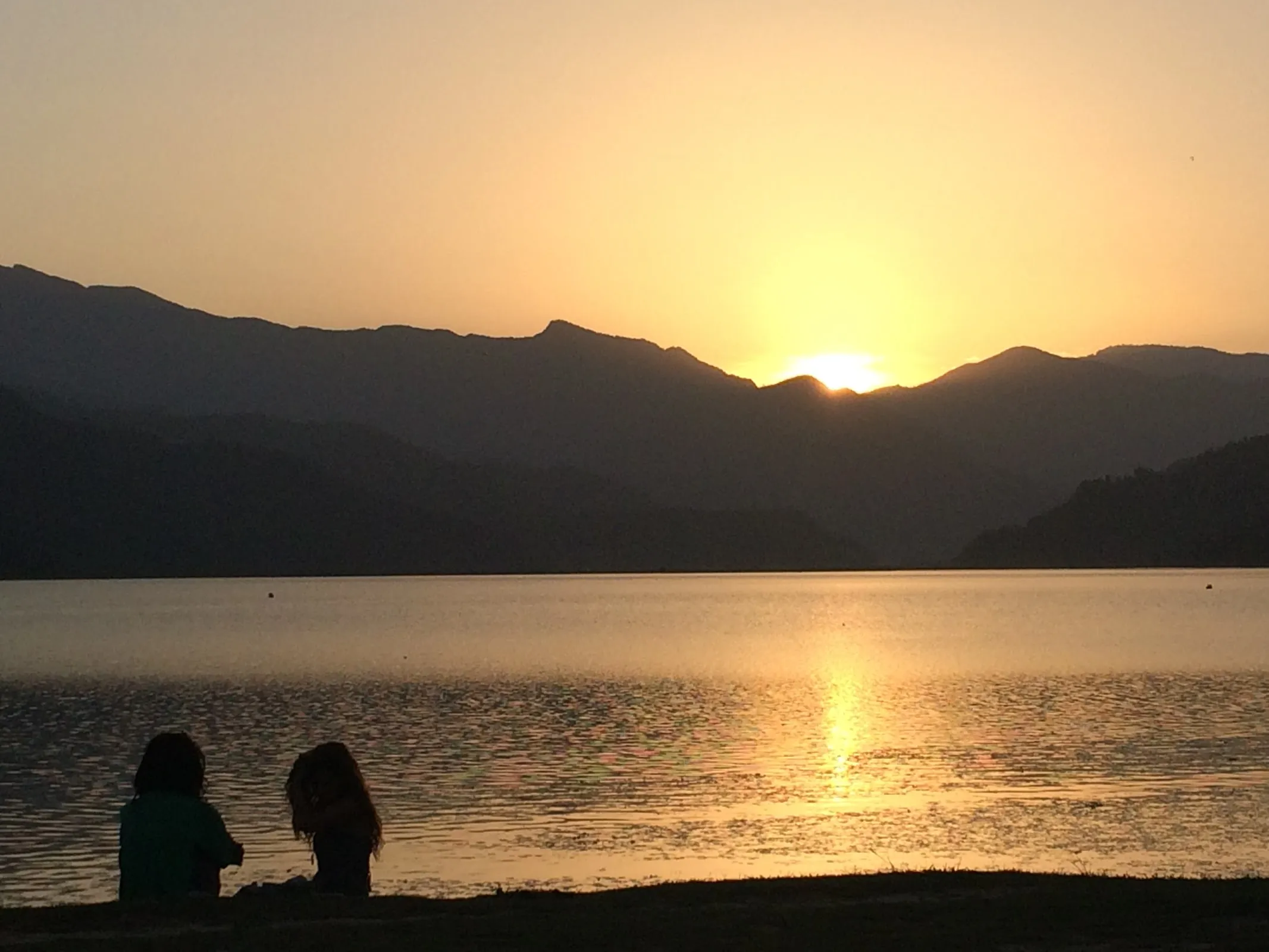 Sunset over Phewa Lake, Pokhara — a five-minute walk from the spa
